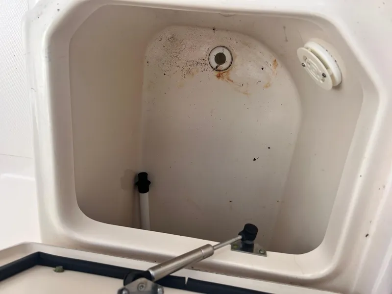 Slide: The Image of Storage compartment of 2007 Grady-White Adventure 208 boat, showing interior details. - 16