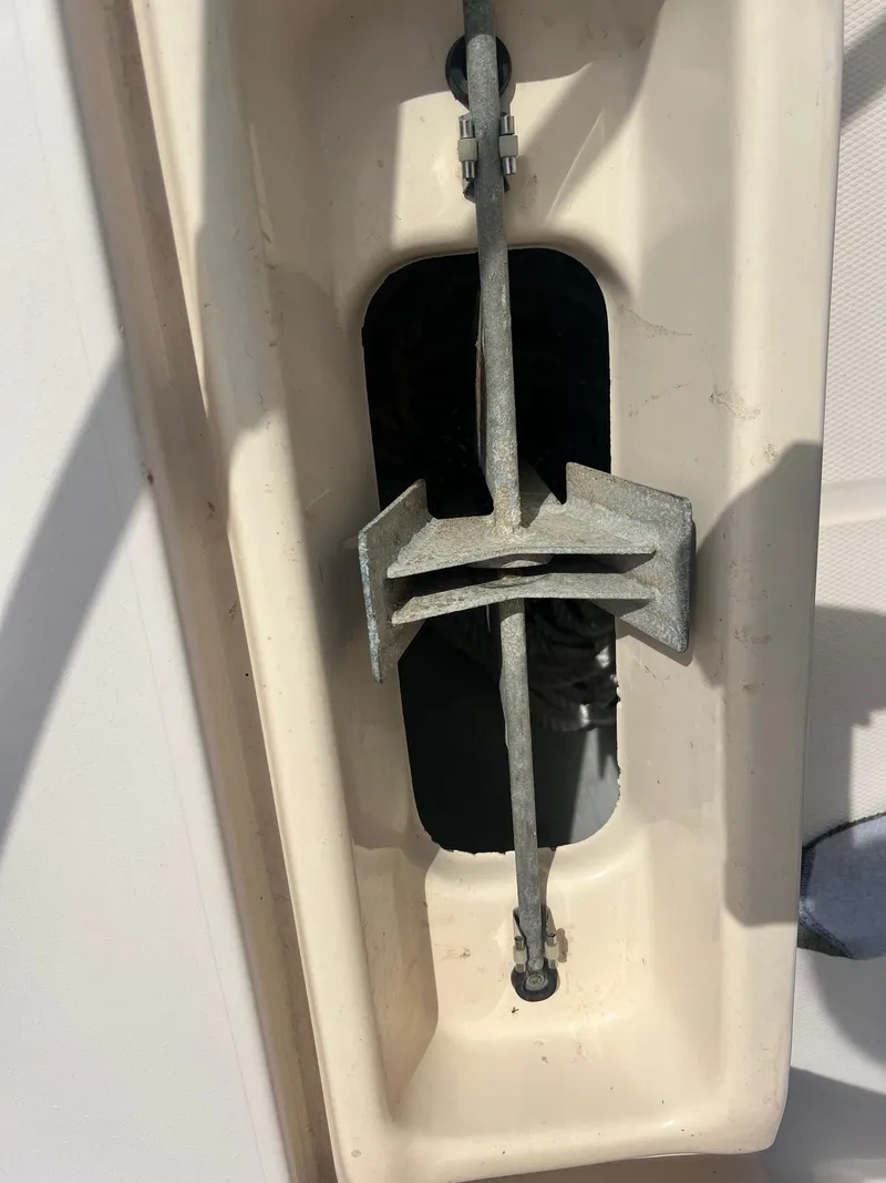 Slide: The Image of Anchor storage compartment on a 2007 Grady-White Adventure 208 boat. - 19