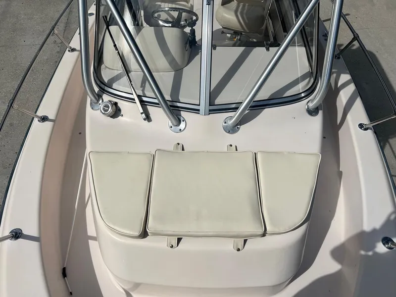 Slide: The Image of 2007 Grady-White Adventure 208 boat interior with cushioned seating and windshield. - 20