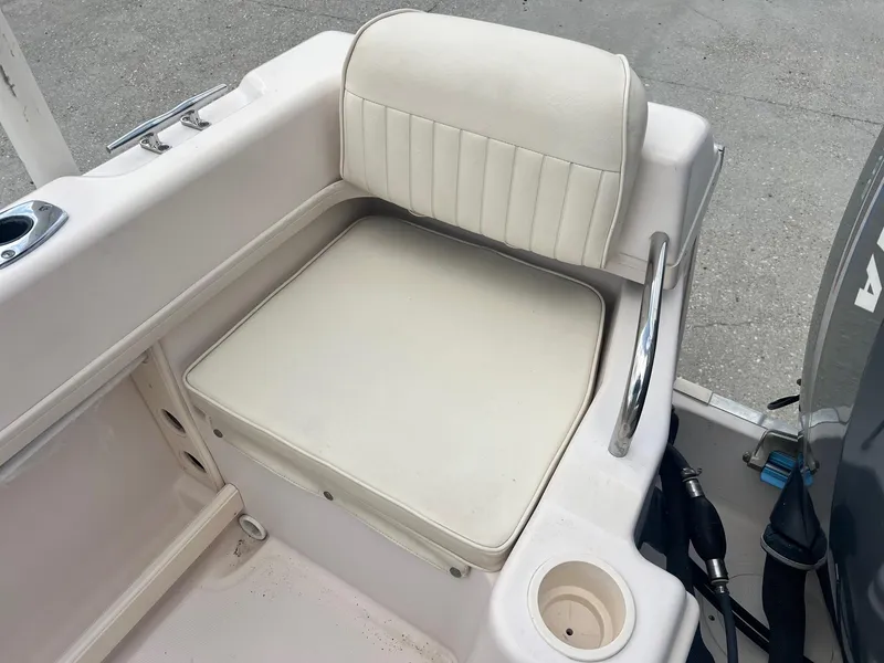 Slide: The Image of 2007 Grady-White Adventure 208 boat seat with cup holder and railing. - 4