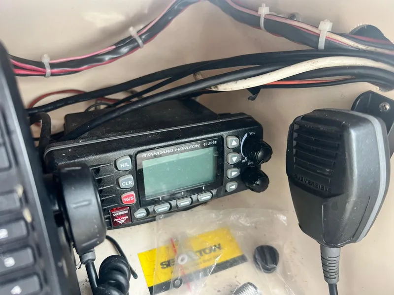 Slide: The Image of Standard Horizon Eclipse radio on 2007 Grady-White Adventure 208 boat dashboard. - 7