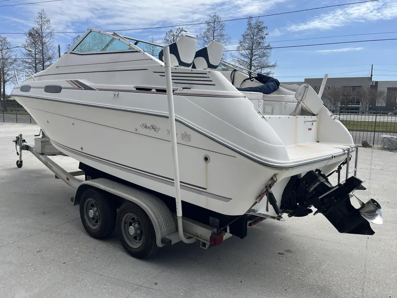 Slide: The Image of 1992 Sea Ray 230 Sundancer boat on trailer, rear view, outdoors. - 4