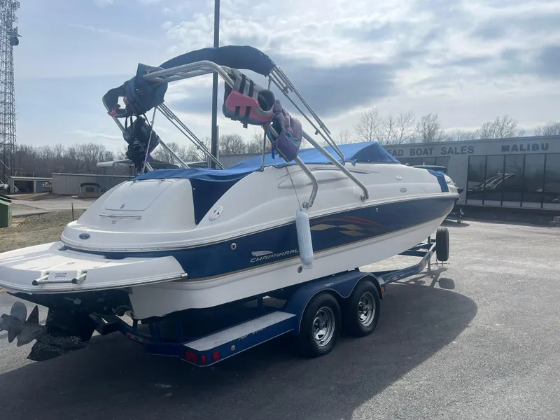 Slide: The Image of 2004 Chaparral Sunesta 254 boat on trailer at dealership, rear view. - 5