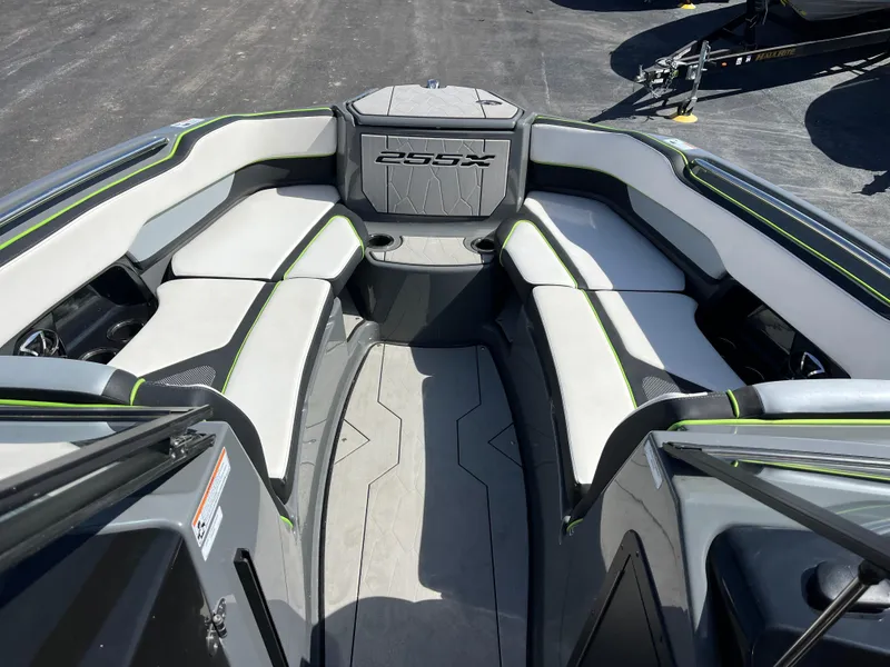 Slide: The Image of 2021 Yamaha Boats 255X interior with spacious seating and modern design. - 14