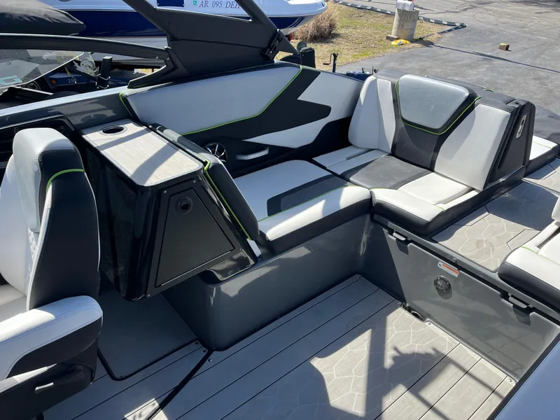 Slide: The Image of 2021 Yamaha Boats 255X interior with modern seating and sleek design. - 9