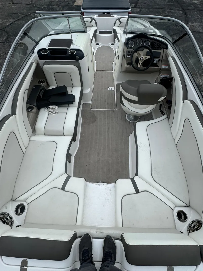 Slide: The Image of 2014 Yamaha Boats 242 Limited S interior with spacious seating and modern dashboard. - 3