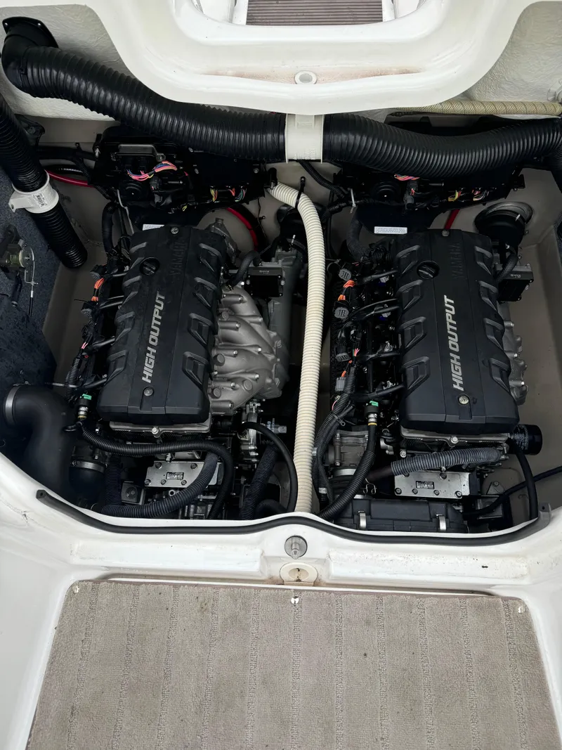 Slide: The Image of 2014 Yamaha Boats 242 Limited S engine compartment with dual high-output engines. - 6