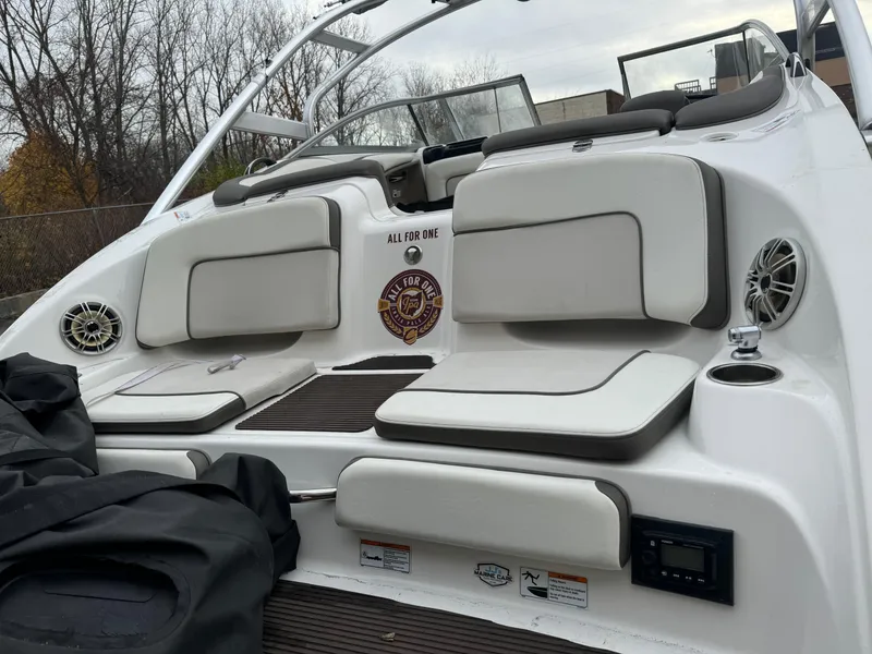 Slide: The Image of 2014 Yamaha Boats 242 Limited S interior with cushioned seating and audio system. - 7