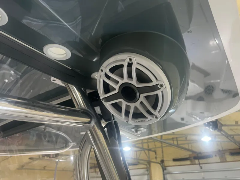 Slide: The Image of 2022 Contender 39 ST boat interior with cushioned seating and rod holders. - 10