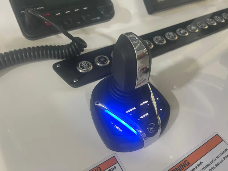 Slide: The Image of 2022 Contender 39 ST boat interior with white cushioned seating and modern design. - 14