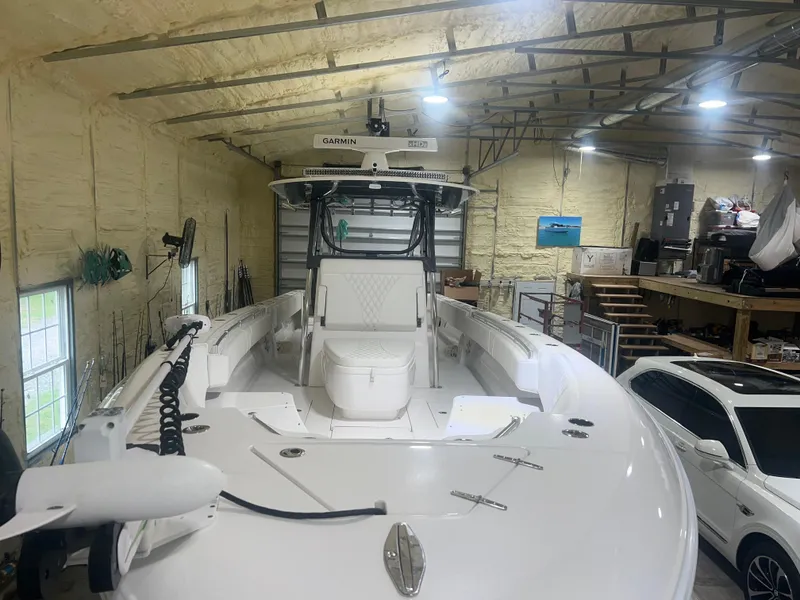 Slide: The Image of 2022 Contender 39 ST boat on trailer in a garage. - 4