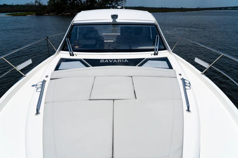 Slide: The Image of 2022 Bavaria SR41 yacht on water, showcasing sleek design and spacious deck. - 8