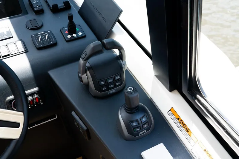 Slide: The Image of Control panel of 2022 Bavaria SR41 boat with joystick and throttle controls. - 9