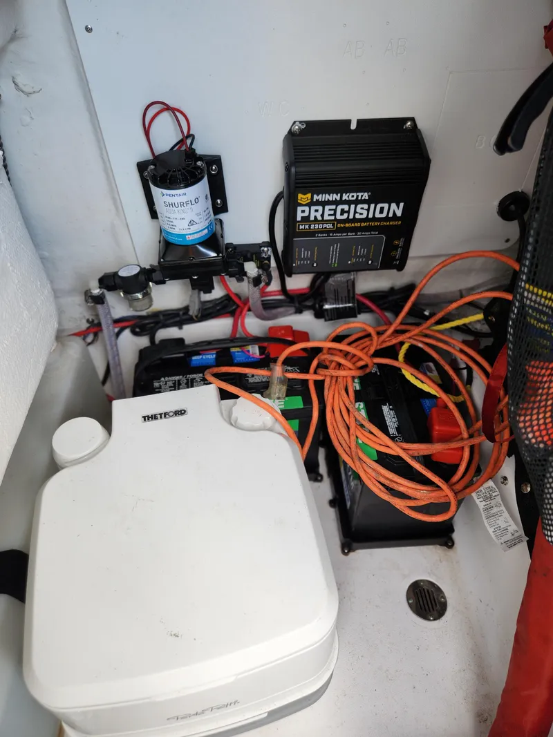 Slide: The Image of 2023 Sportsman Heritage 211 Center Console boat electrical setup with Minn Kota Precision charger. - 17