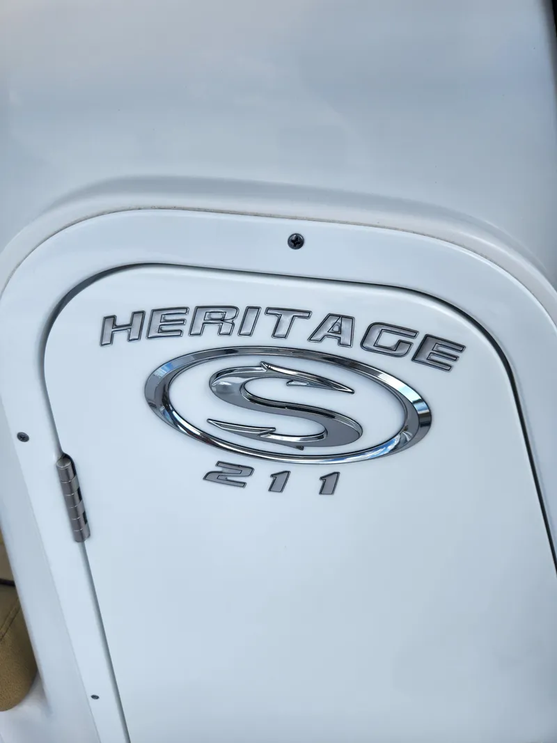 Slide: The Image of 2023 Sportsman Heritage 211 Center Console boat emblem detail. - 18