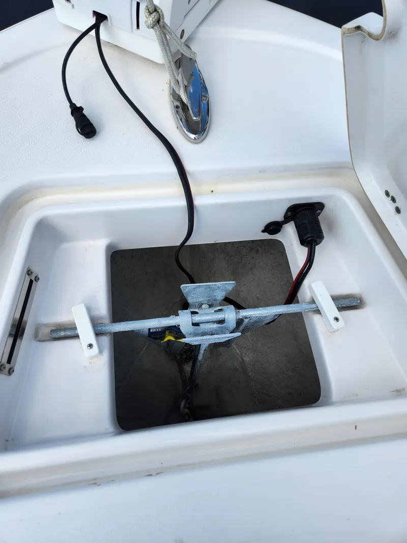 Slide: The Image of Anchor storage compartment on 2023 Sportsman Heritage 211 Center Console boat. - 19