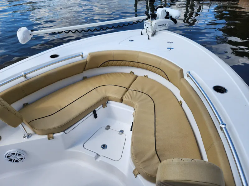 Slide: The Image of 2023 Sportsman Heritage 211 Center Console boat with tan seating and white deck. - 25