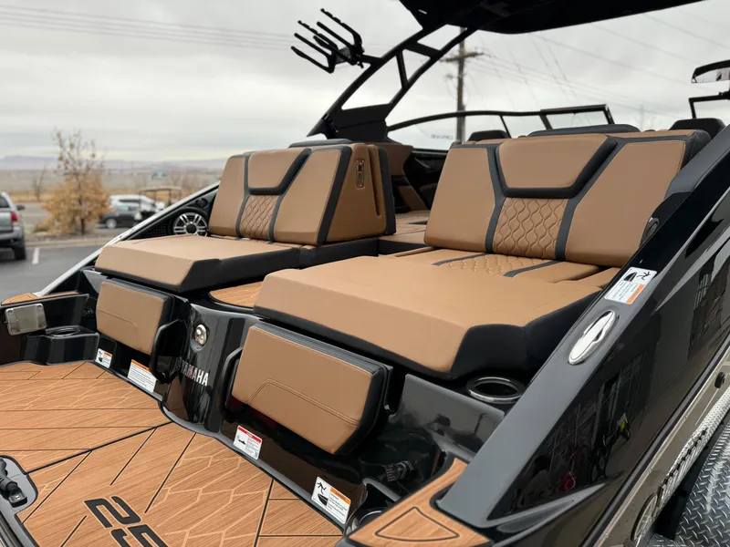 Slide: The Image of 2025 Yamaha Boats 255XD with luxurious tan seating and sleek black accents. - 15