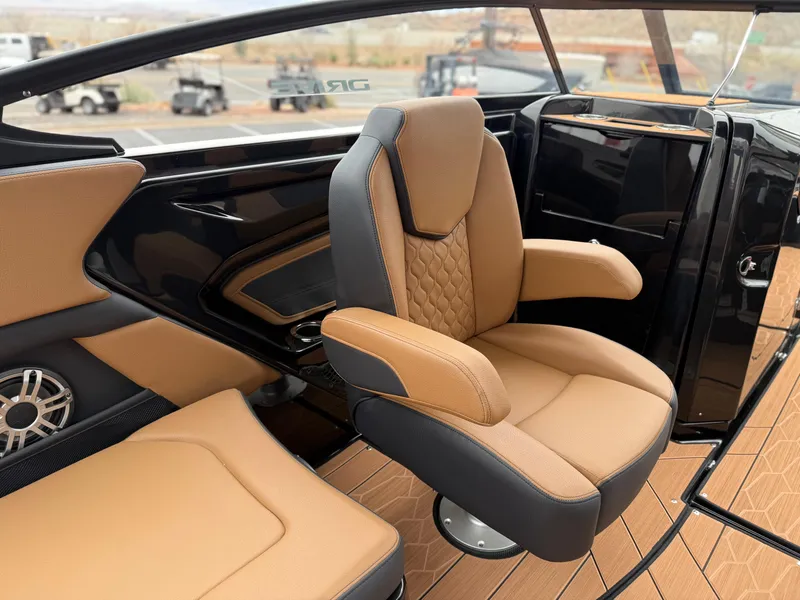 Slide: The Image of 2025 Yamaha Boats 255XD interior with tan and black seating, modern design. - 32