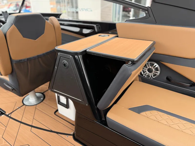 Slide: The Image of 2025 Yamaha Boats 255XD interior with tan seating and modern design features. - 43