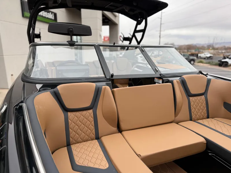 Slide: The Image of 2025 Yamaha Boats 255XD interior with tan and black seating, modern design. - 63