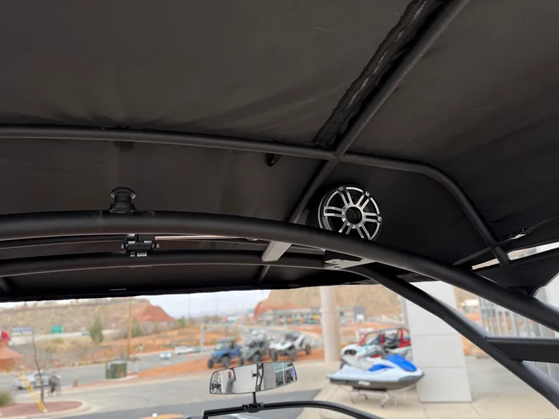 Slide: The Image of 2025 Yamaha Boats 255XD interior with speaker and canopy view. - 79