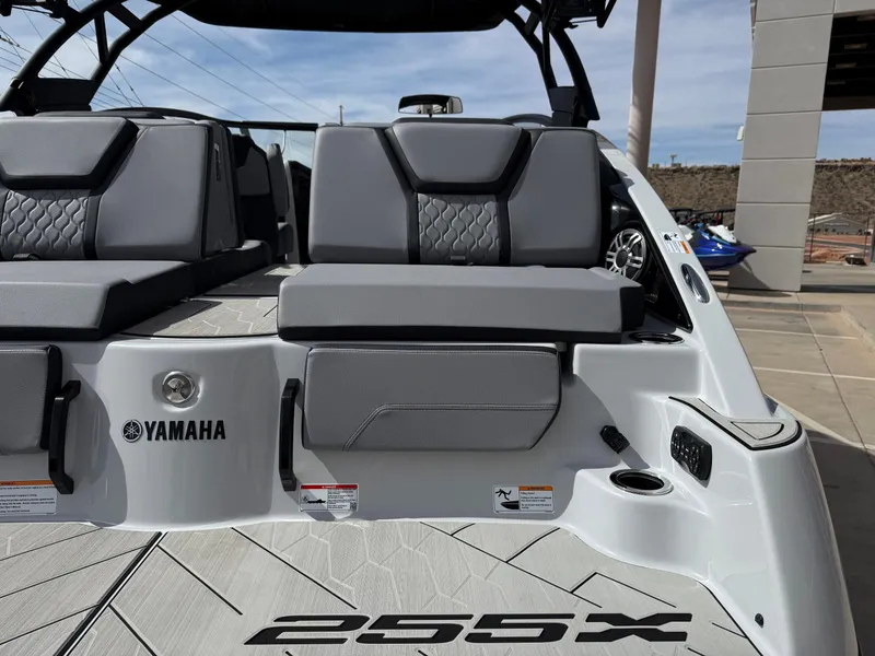 Slide: The Image of 2025 Yamaha Boats 255XD interior with gray seating and logo, showcasing modern design. - 17