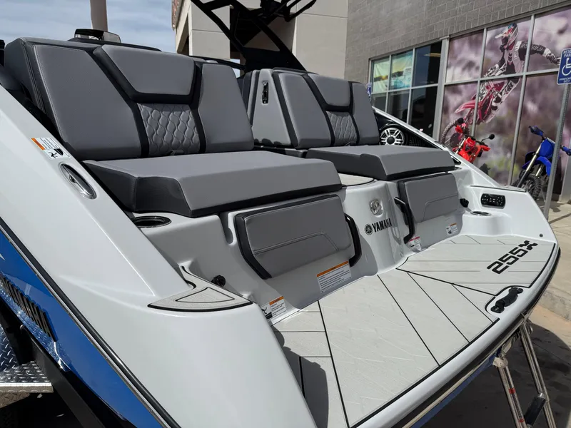 Slide: The Image of 2025 Yamaha Boats 255XD with sleek gray seating and modern design. - 21