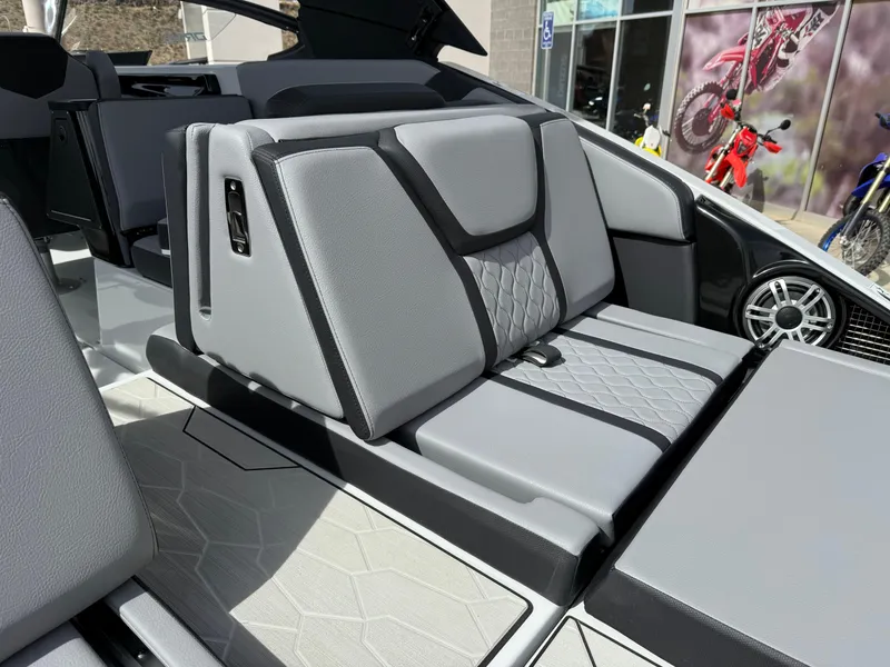 Slide: The Image of 2025 Yamaha Boats 255XD interior with sleek, modern seating design and premium materials. - 23