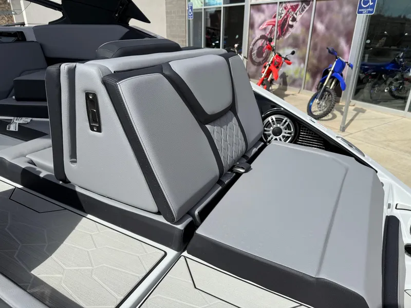 Slide: The Image of 2025 Yamaha Boats 255XD interior seating with modern design and gray upholstery. - 25