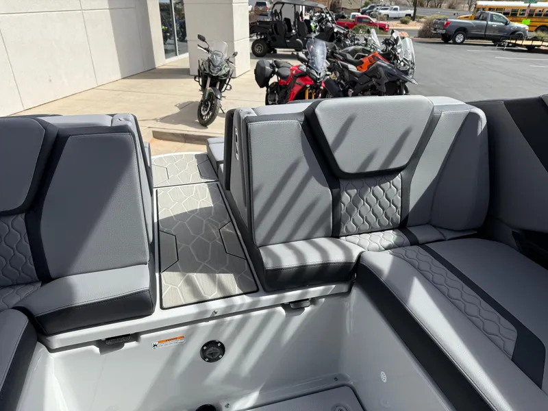 Slide: The Image of 2025 Yamaha Boats 255XD interior with gray seating and modern design. - 30