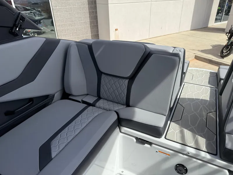 Slide: The Image of 2025 Yamaha Boats 255XD interior with modern gray seating and geometric design. - 31
