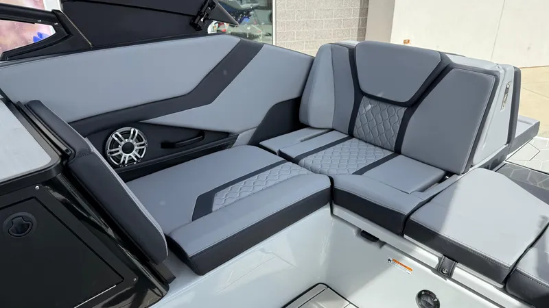 Slide: The Image of 2025 Yamaha Boats 255XD interior with sleek gray seating and modern design. - 32