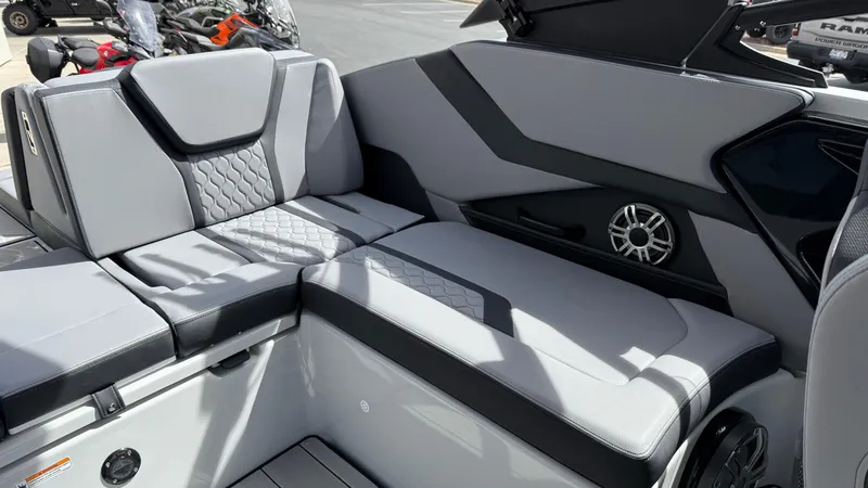 Slide: The Image of 2025 Yamaha Boats 255XD interior with sleek gray seating and modern design. - 33