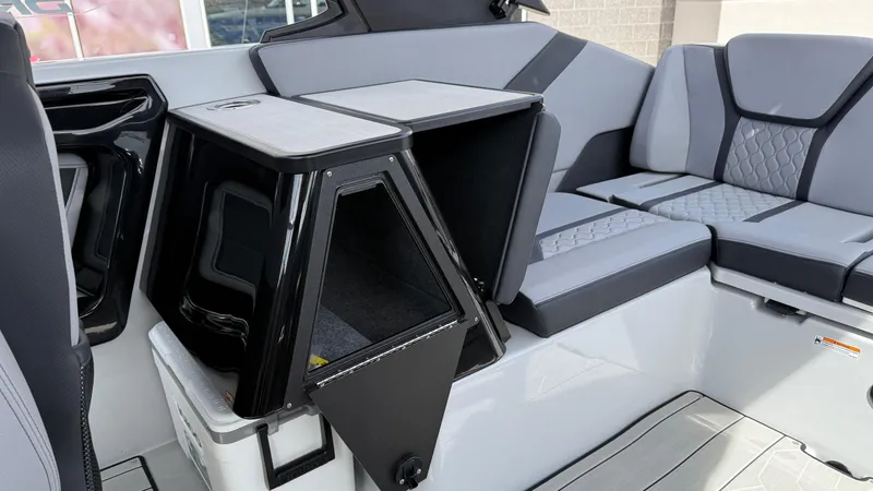 Slide: The Image of 2025 Yamaha Boats 255XD interior with sleek seating and storage compartments. - 37