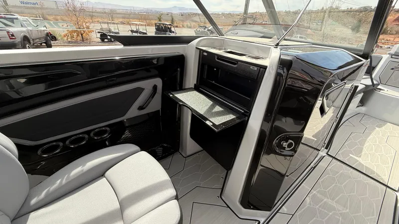 Slide: The Image of 2025 Yamaha Boats 255XD interior with sleek design and modern amenities. - 41