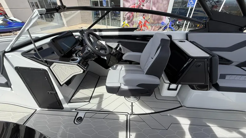 Slide: The Image of 2025 Yamaha Boats 255XD interior with modern helm, sleek design, and comfortable seating. - 45