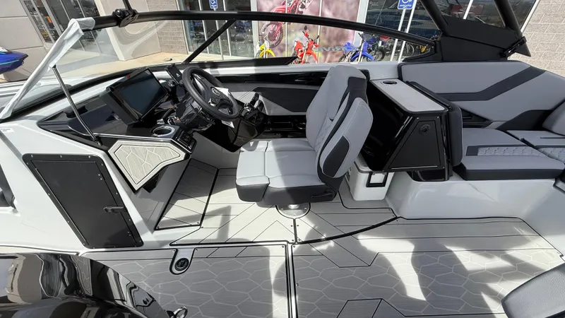 Slide: The Image of 2025 Yamaha Boats 255XD interior with modern helm, seating, and sleek design. - 46