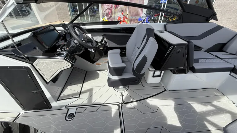Slide: The Image of Interior of 2025 Yamaha Boats 255XD, featuring modern helm and seating design. - 47