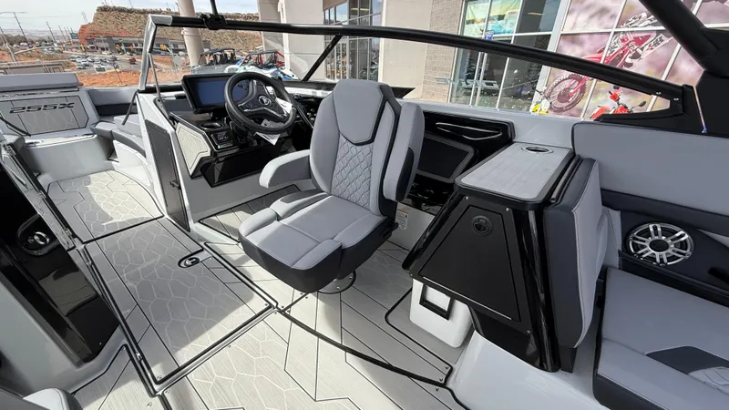 Slide: The Image of Interior of 2025 Yamaha Boats 255XD, featuring modern seating and advanced dashboard controls. - 48