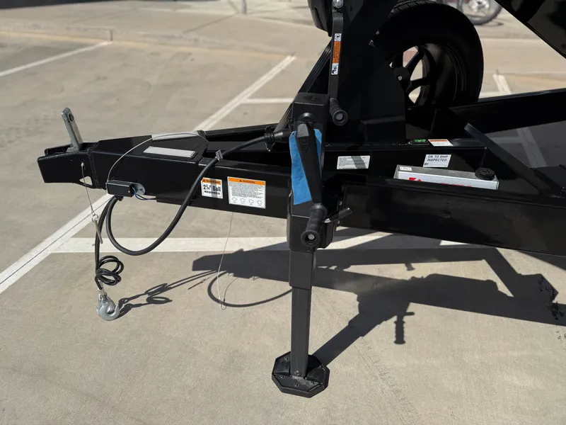 Slide: The Image of Trailer hitch of a 2025 Yamaha Boats 275 SD on a concrete surface. - 14