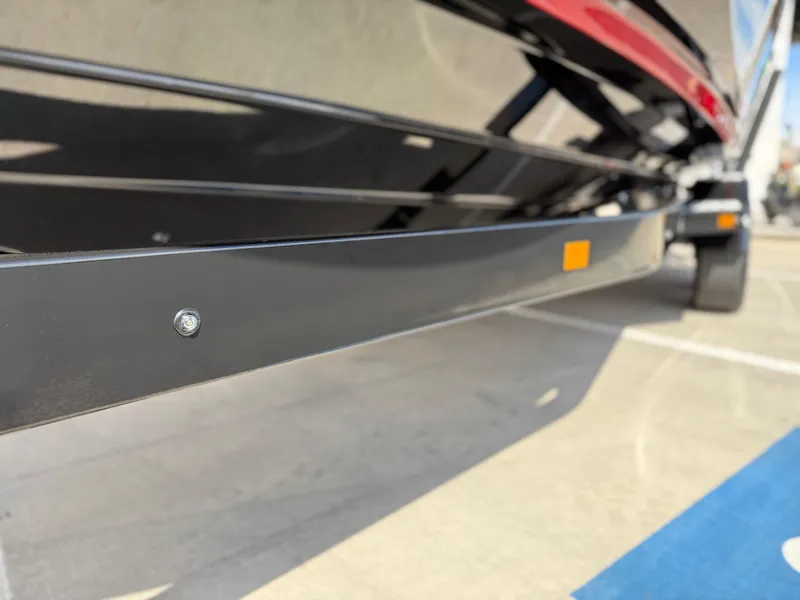 Slide: The Image of 2025 Yamaha Boats 275 SD trailer close-up, showcasing sleek design and sturdy construction. - 16