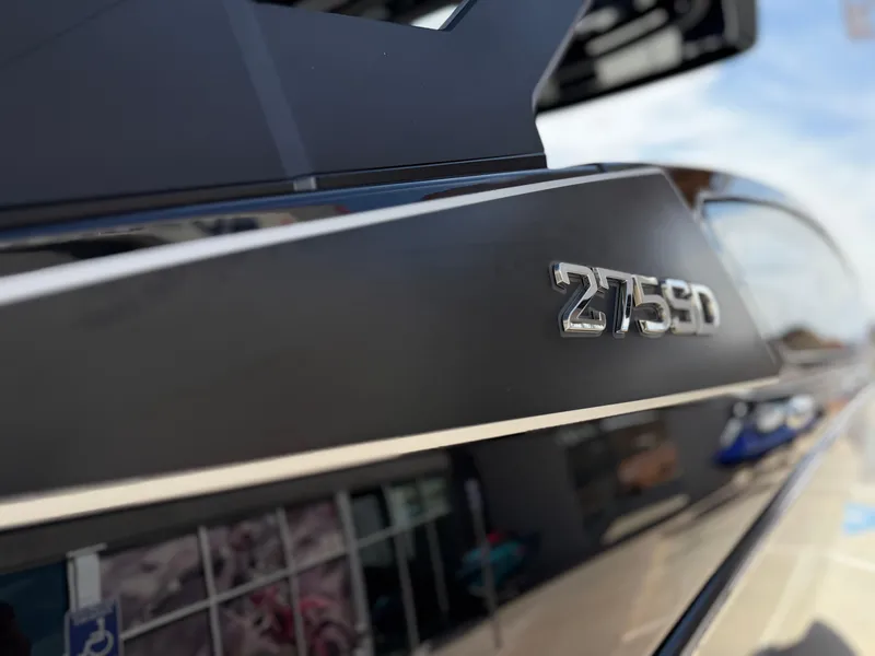 Slide: The Image of 2025 Yamaha Boats 275 SD, sleek design with metallic detailing. - 21