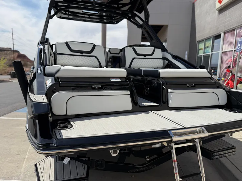 Slide: The Image of 2025 Yamaha Boats 275 SD, luxury seating, sleek design, outdoor display. - 26