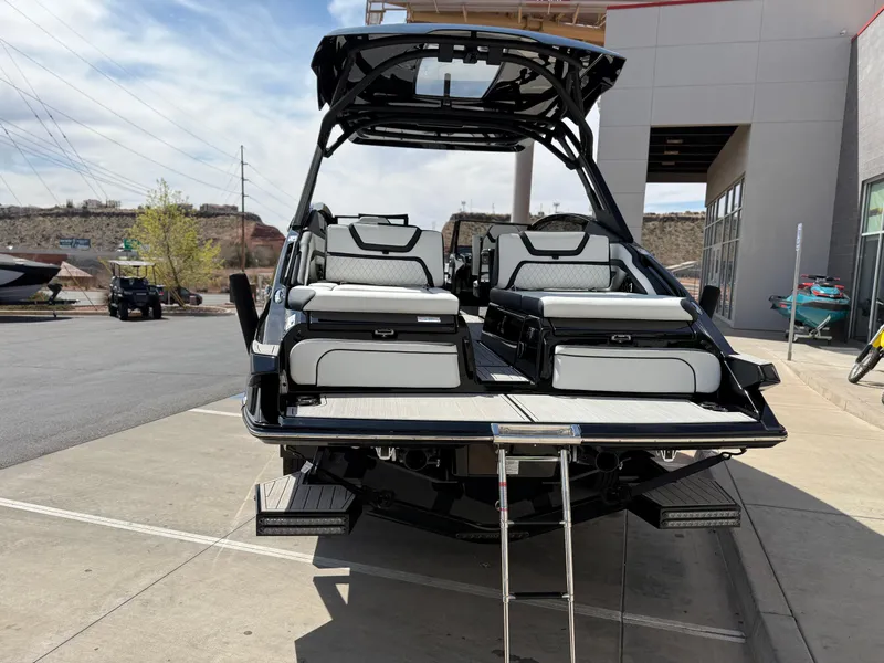 Slide: The Image of 2025 Yamaha Boats 275 SD, sleek design, rear view, docked outdoors. - 4