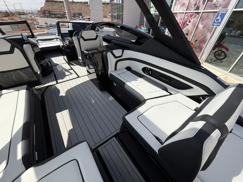 Slide: The Image of 2025 Yamaha Boats 275 SD interior with sleek, modern seating and spacious layout. - 47