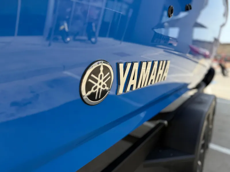 Slide: The Image of 2025 Yamaha AR250 boat, close-up of blue exterior with logo. - 20