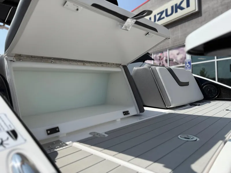 Slide: The Image of 2025 Yamaha AR250 boat storage compartment open, showcasing spacious interior. - 26