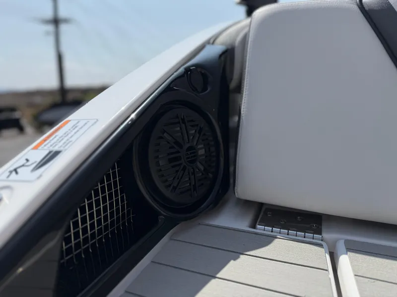 Slide: The Image of 2025 Yamaha Boats AR250 interior speaker and seating detail. - 31