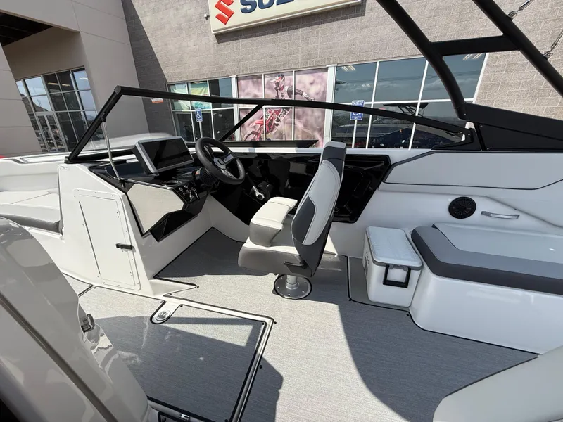 Slide: The Image of 2025 Yamaha Boats AR250 interior with modern dashboard and seating. - 43